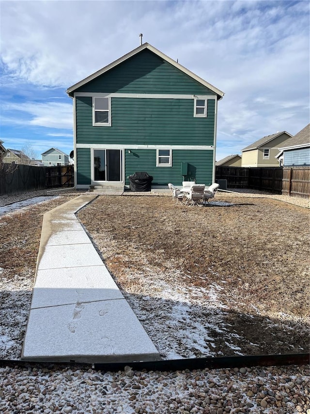 rear view of house featuring a patio