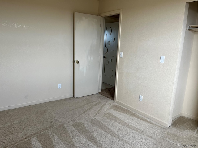 unfurnished bedroom with light carpet