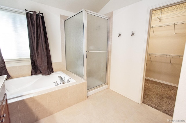 17672 E Weaver Pl, Aurora, CO 80016 - full bath with a shower stall, a bath, a spacious closet, and tile patterned flooring