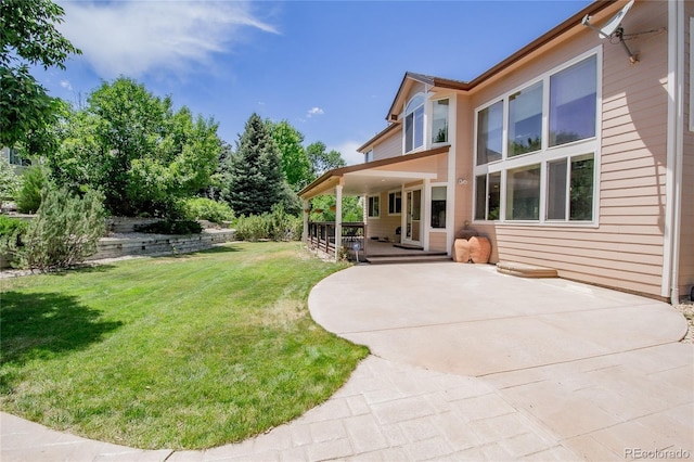 17672 E Weaver Pl, Aurora, CO 80016 - view of green lawn with a patio area