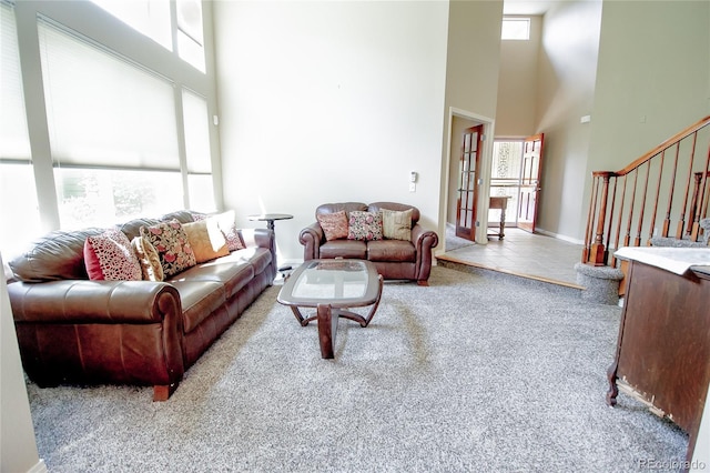 17672 E Weaver Pl, Aurora, CO 80016 - carpeted living room featuring a high ceiling and stairway