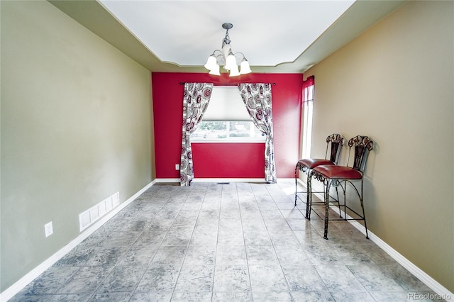 17672 E Weaver Pl, Aurora, CO 80016 - dining space featuring a chandelier and baseboards