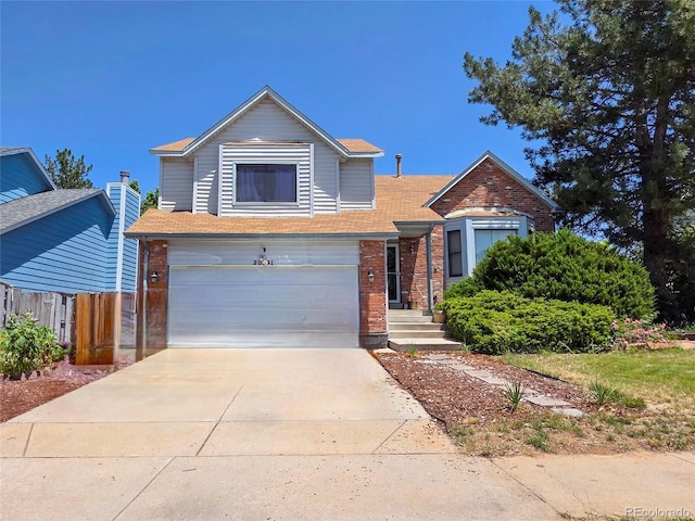 20391 E 42nd Ave, Denver, CO 80249 - view of front facade with brick siding, an attached garage, concrete driveway, and roof with shingles