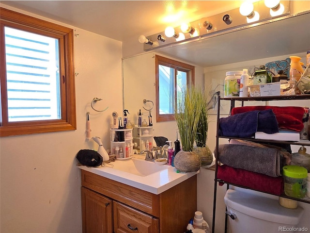 20391 E 42nd Ave, Denver, CO 80249 - bathroom featuring vanity and toilet