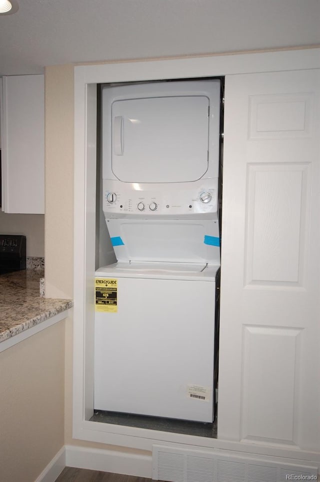 washroom featuring estacked washer and dryer