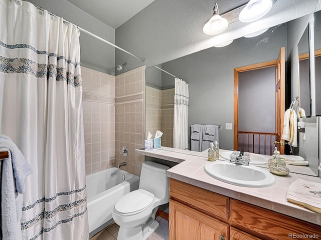 full bathroom with tile patterned flooring, vanity, shower / tub combo with curtain, and toilet