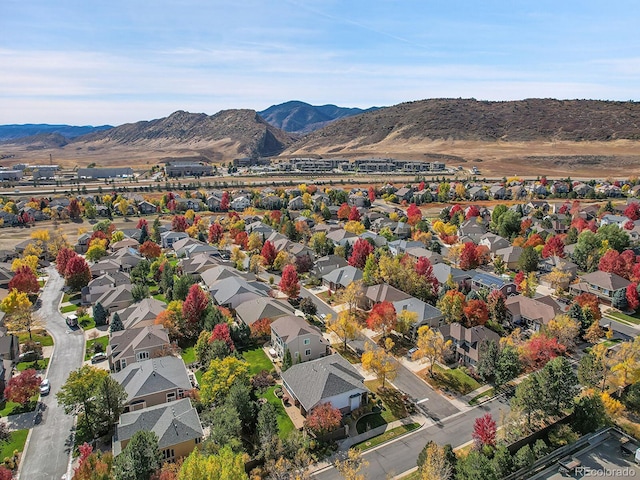 birds eye view of property with a mountain view