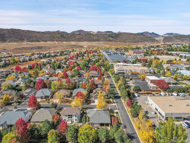 birds eye view of property with a mountain view