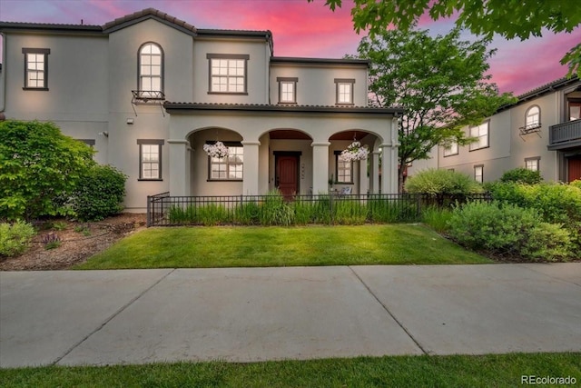 3372 Central Park Blvd, Denver, CO 80238 - mediterranean / spanish-style home with a porch and stucco siding