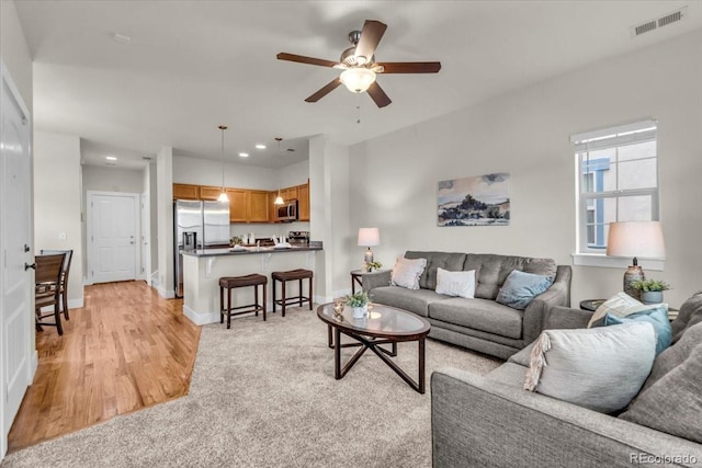 3372 Central Park Blvd, Denver, CO 80238 - living room featuring light wood-style flooring, a ceiling fan, recessed lighting, and baseboards