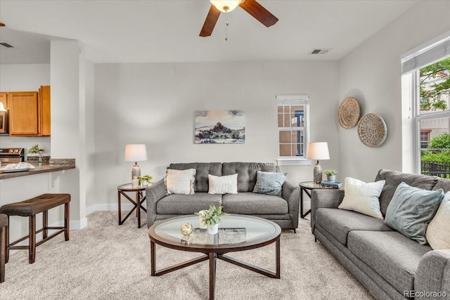 3372 Central Park Blvd, Denver, CO 80238 - living room with ceiling fan, light carpet, and baseboards