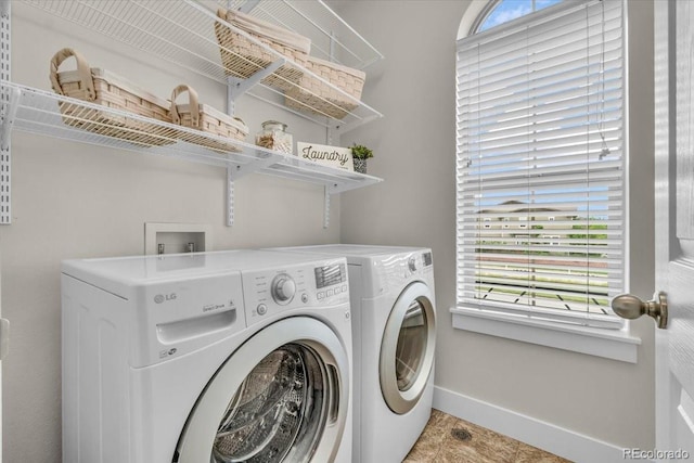 3372 Central Park Blvd, Denver, CO 80238 - laundry room featuring washing machine and clothes dryer and baseboards