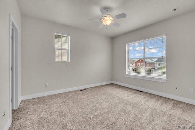 3372 Central Park Blvd, Denver, CO 80238 - unfurnished room featuring carpet floors, baseboards, and a ceiling fan