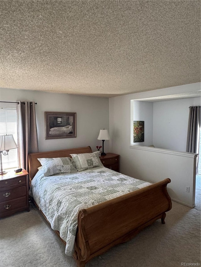 12534 E Pacific Cir Unit A, Aurora, CO 80014 - carpeted bedroom with a textured ceiling