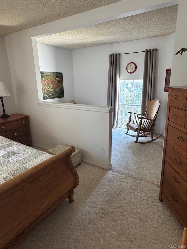 12534 E Pacific Cir Unit A, Aurora, CO 80014 - bedroom featuring light carpet and a textured ceiling