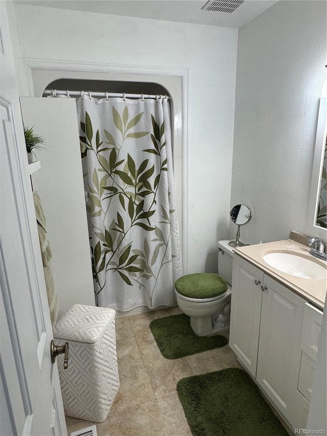 12534 E Pacific Cir Unit A, Aurora, CO 80014 - full bathroom with vanity, a shower with shower curtain, and tile patterned flooring