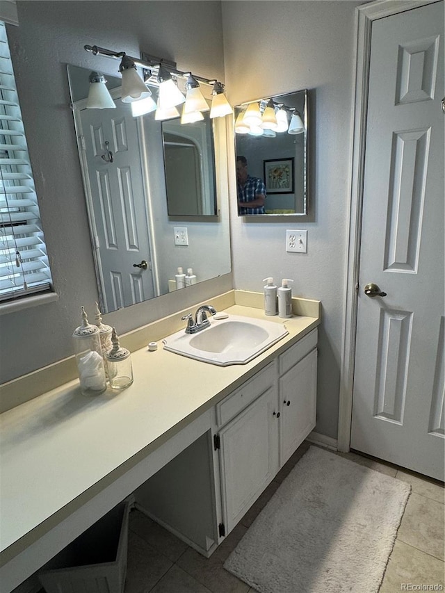 12534 E Pacific Cir Unit A, Aurora, CO 80014 - bathroom featuring tile patterned floors and vanity