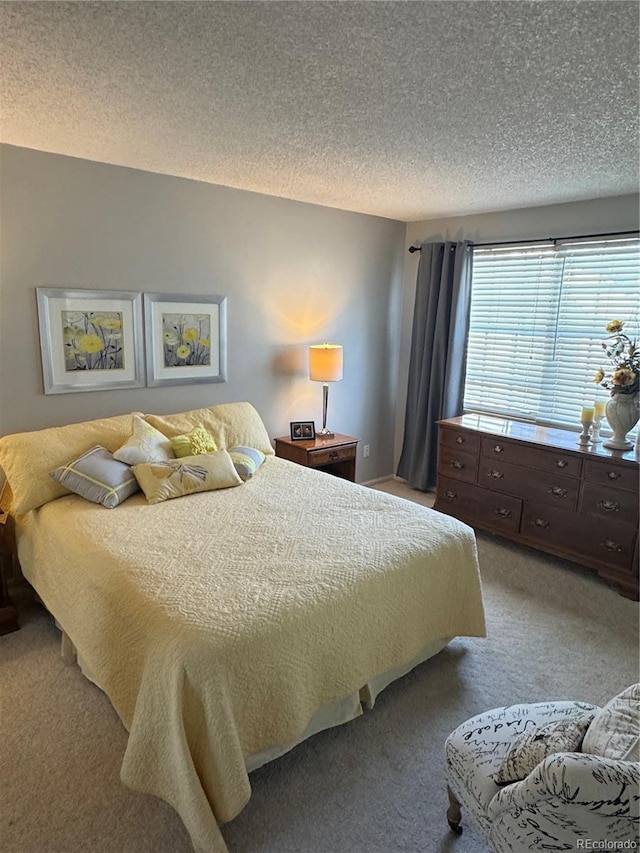 12534 E Pacific Cir Unit A, Aurora, CO 80014 - bedroom featuring light colored carpet and a textured ceiling