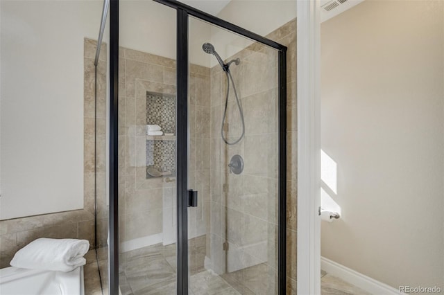 full bath with a shower stall