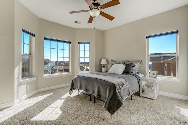 bedroom with carpet, visible vents, ceiling fan, and baseboards