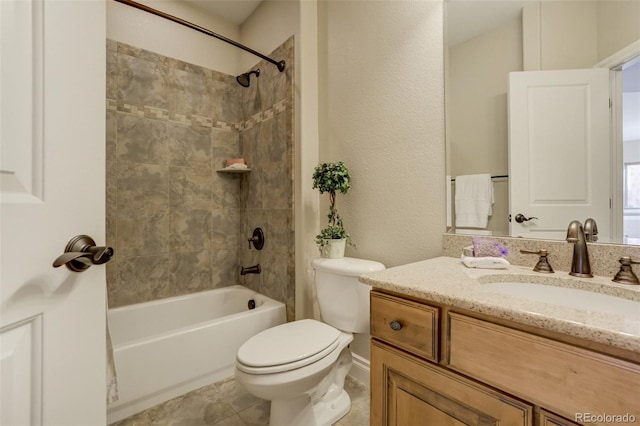 bathroom featuring a textured wall, toilet, vanity, tile patterned floors, and shower / bathtub combination