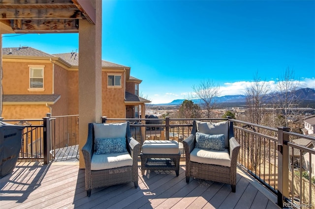 wooden terrace featuring a mountain view