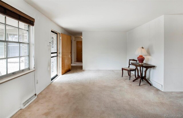 empty room with visible vents and carpet flooring