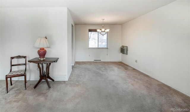 dining area with visible vents, an inviting chandelier, carpet flooring, and a wall mounted AC