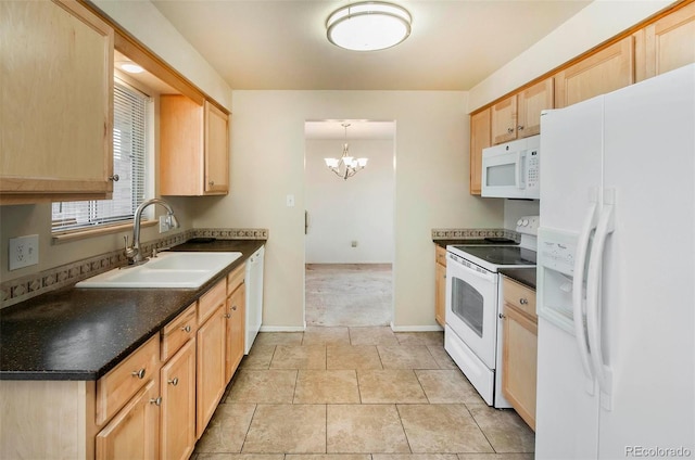 kitchen featuring a sink, white appliances, dark countertops, and light brown cabinets