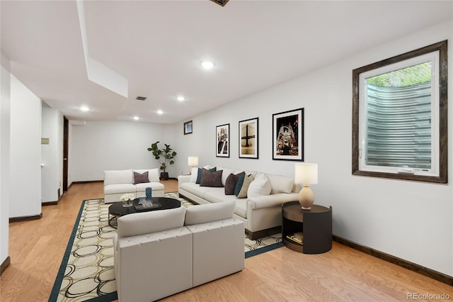 living room with light hardwood / wood-style flooring