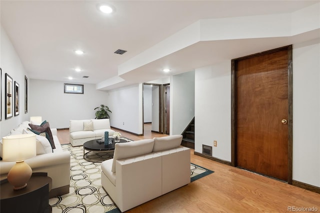 living room with light hardwood / wood-style flooring