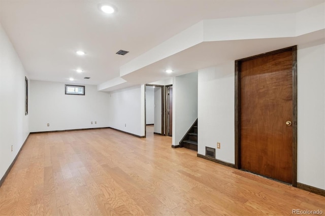 basement featuring light wood-type flooring