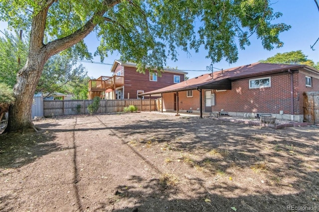 back of property with a shed