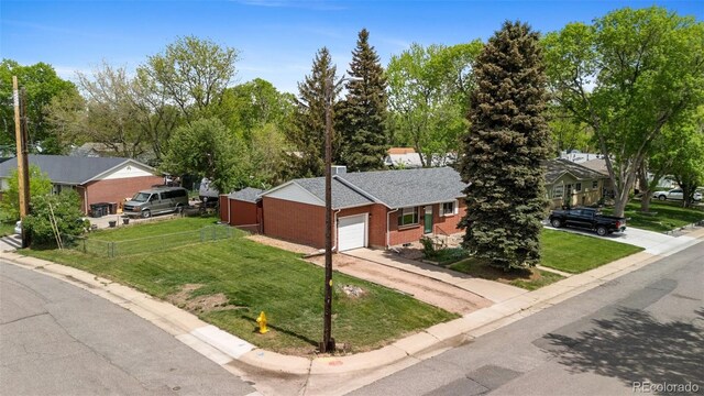 view of front of home with brick siding, driveway, and a garage