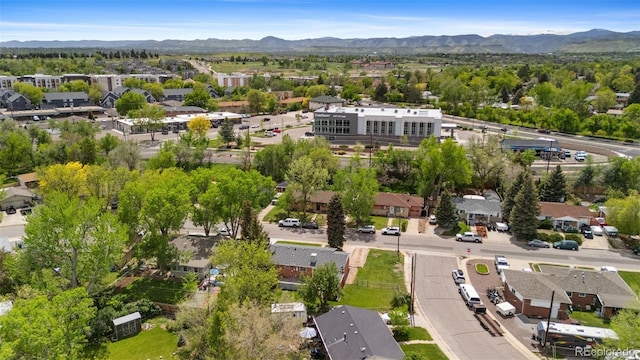 aerial perspective of suburban area featuring a mountainous background