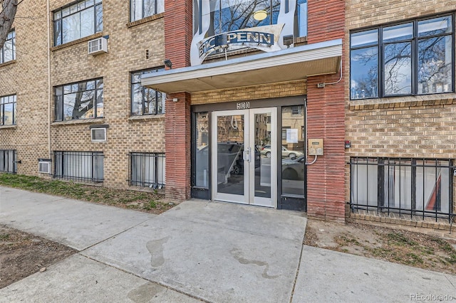 500 E 11th Ave Unit 305, Denver, CO 80203 - entrance to property featuring french doors, brick siding, and an AC wall unit