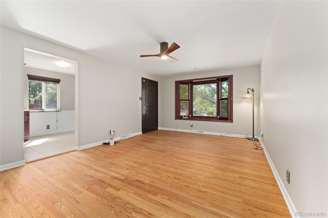 2692 S Pennsylvania St, Denver, CO 80210 - unfurnished bedroom with ceiling fan, baseboards, visible vents, and light wood-style flooring