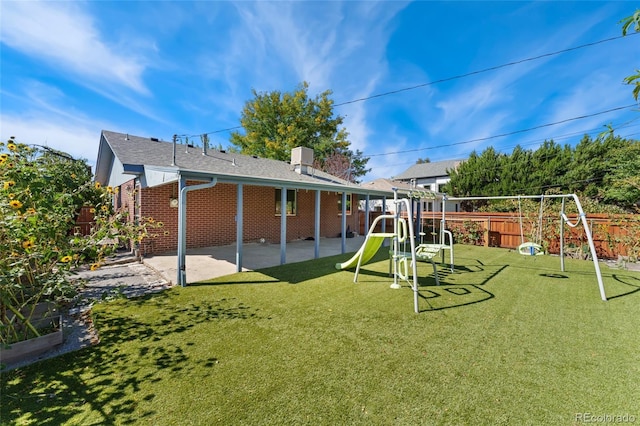 2692 S Pennsylvania St, Denver, CO 80210 - exterior space featuring a lawn, fence, and a patio area
