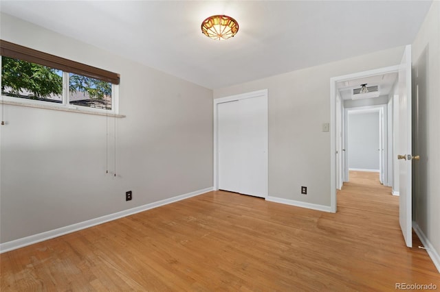 2692 S Pennsylvania St, Denver, CO 80210 - unfurnished bedroom featuring visible vents, baseboards, a closet, and light wood-type flooring