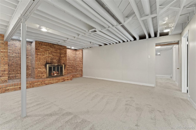 2692 S Pennsylvania St, Denver, CO 80210 - finished below grade area with carpet floors, baseboards, a brick fireplace, and brick wall