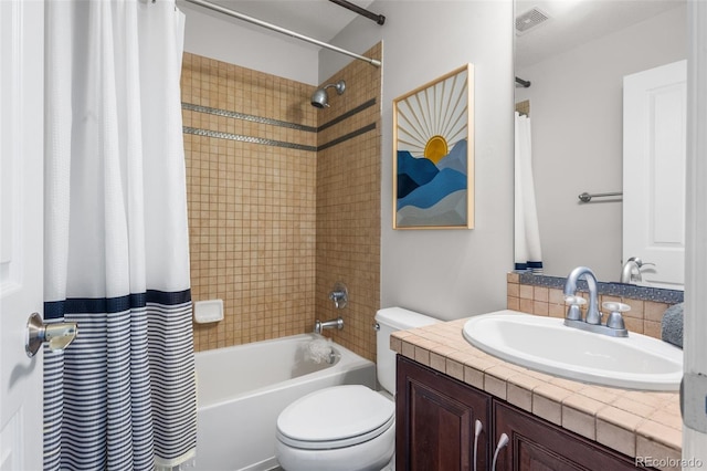 full bathroom with toilet, shower / bath combo with shower curtain, and vanity