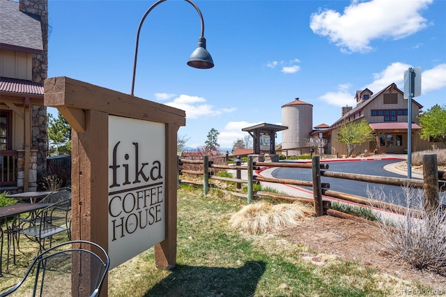 community sign featuring fence