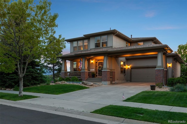 12119 S Wanderlust Way, Parker, CO 80138 - prairie-style home with a porch, a yard, concrete driveway, and a garage