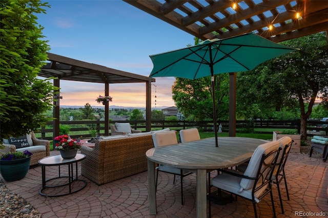 12119 S Wanderlust Way, Parker, CO 80138 - patio terrace at dusk featuring a pergola, a patio area, and outdoor lounge area