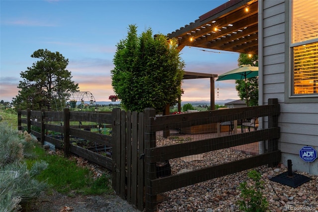 12119 S Wanderlust Way, Parker, CO 80138 - yard at dusk featuring a pergola and a gate