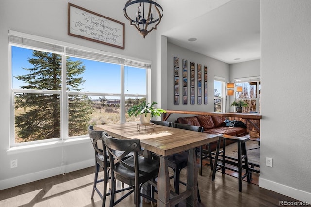 12119 S Wanderlust Way, Parker, CO 80138 - dining space with baseboards, wood finished floors, a chandelier, and breakfast area
