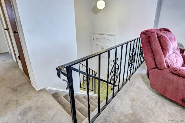 stairs with carpet and baseboards