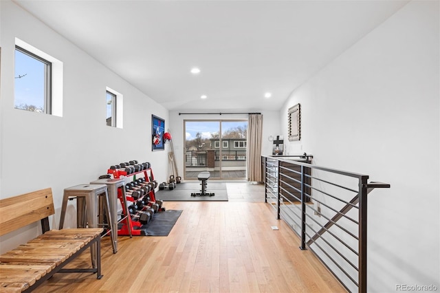 exercise area featuring wood-type flooring and recessed lighting