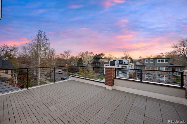 view of patio / terrace with a balcony and a residential view