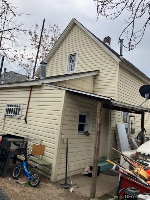 615 E 49th Ave, Denver, CO 80216 - back of property with a chimney